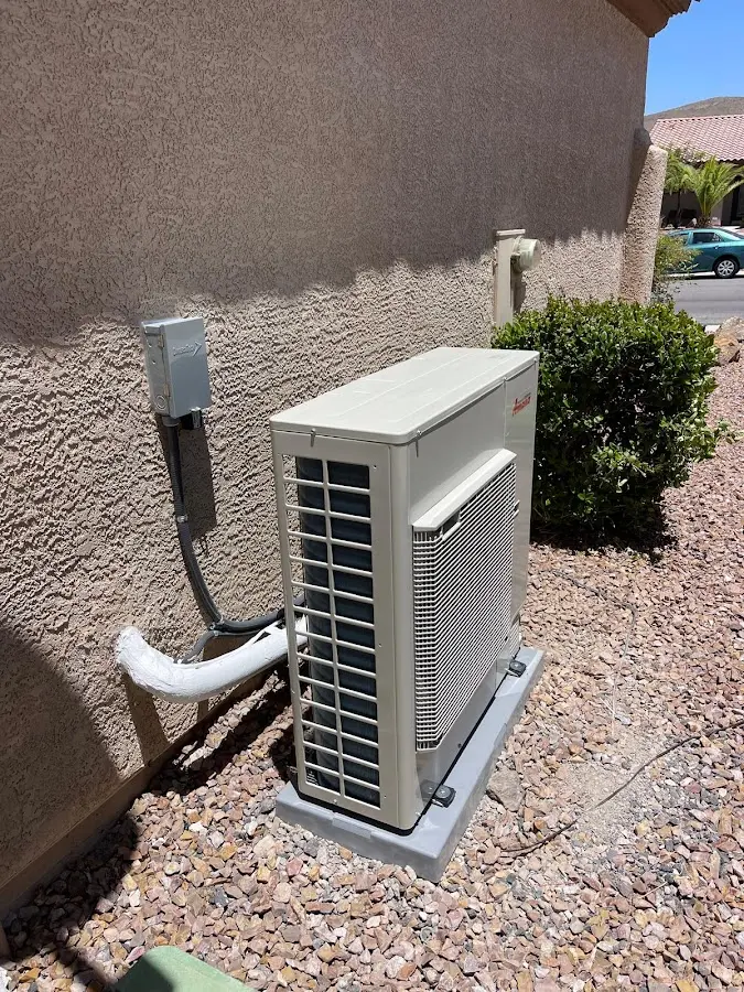 Residential air conditioning condenser unit in Dixon